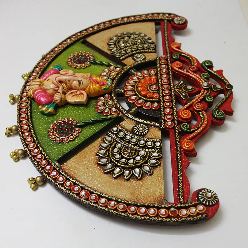 Angled close-up of the textured multicolour Ganesha wall accent