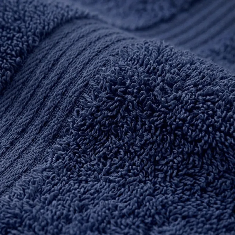 Close-up of navy towel fabric with textured cotton loops