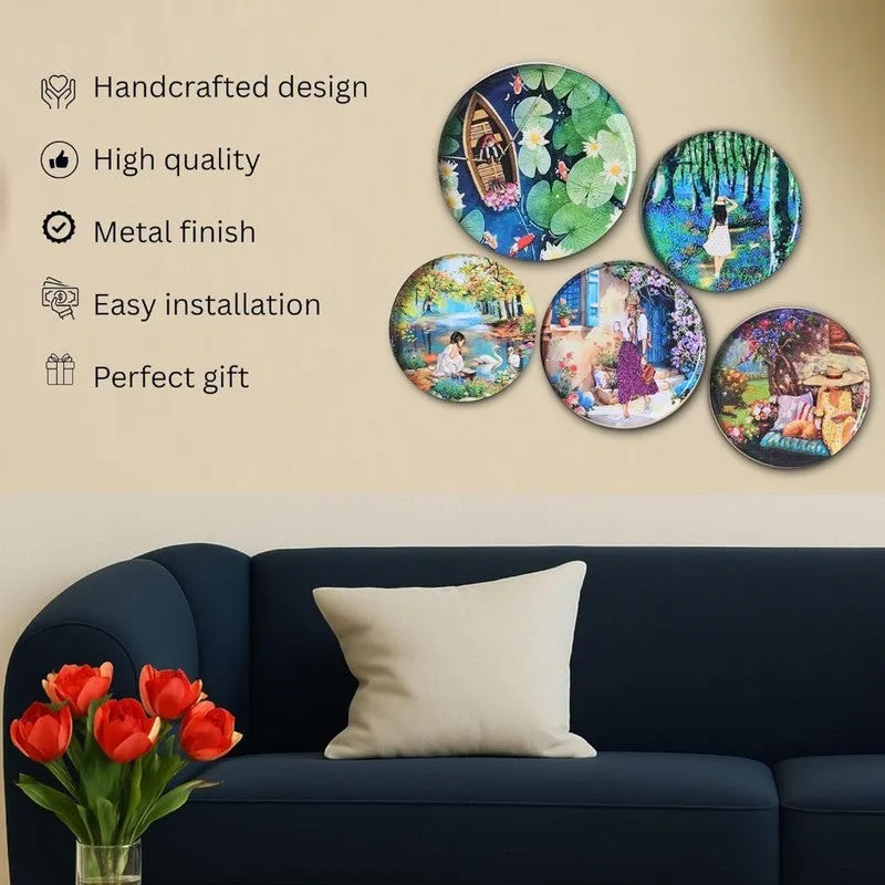 Five colourful wall plates displayed above a sofa in a living room.