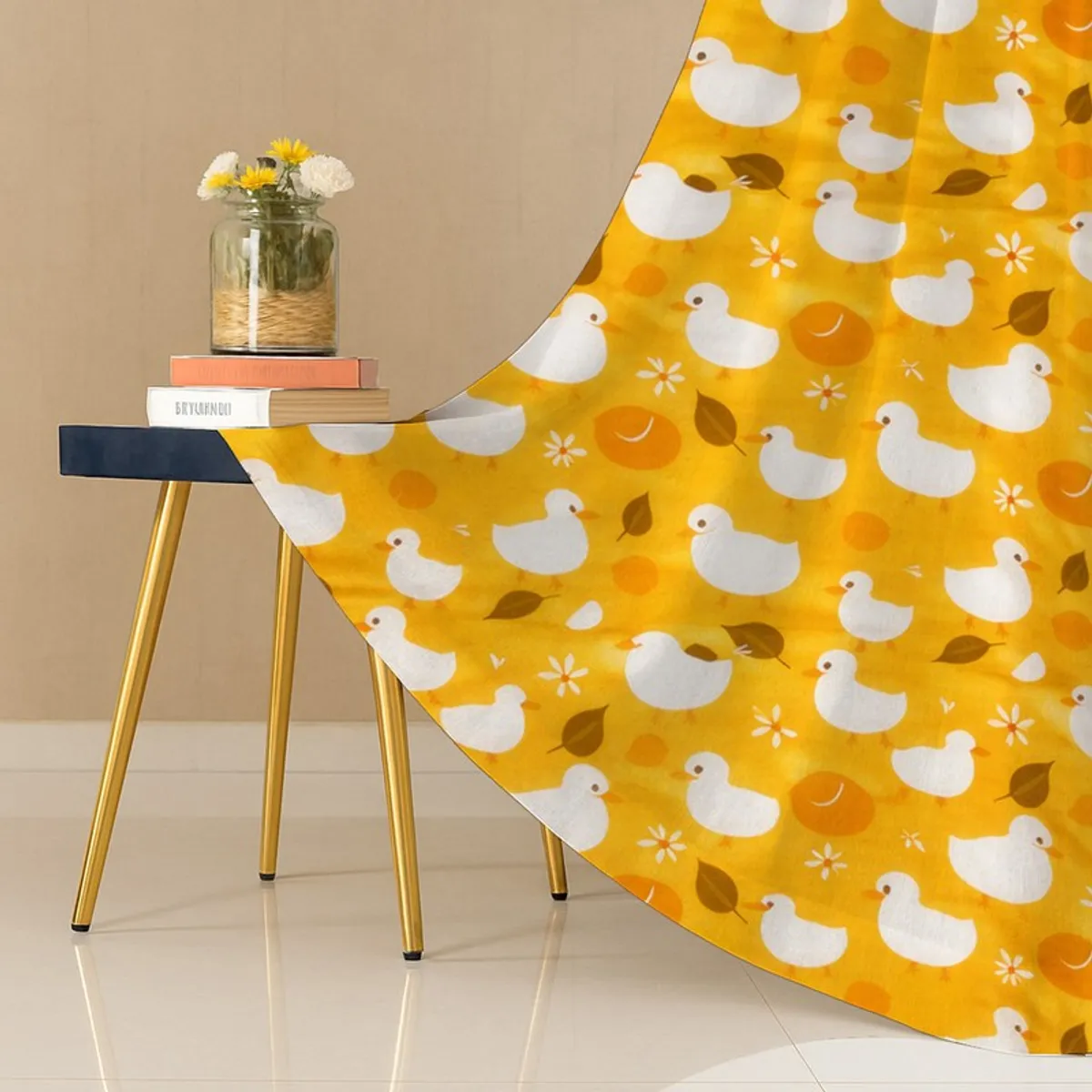 Close-up of yellow duck print curtain fabric draped beside a small table