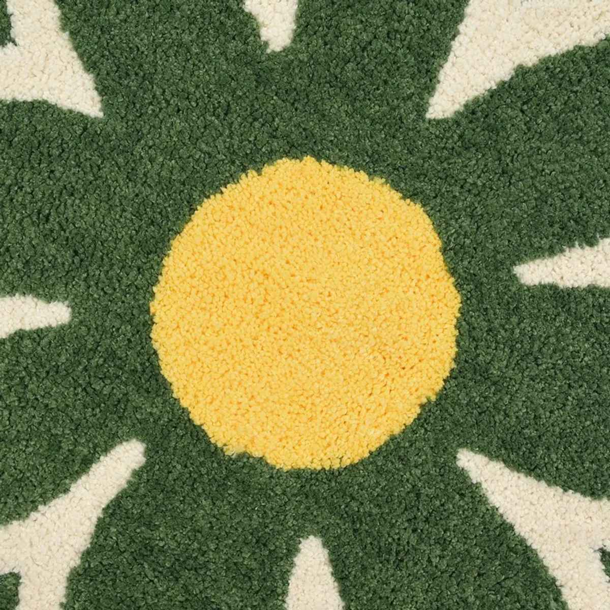 Close-up of the yellow centre and green floral texture on the bath mat