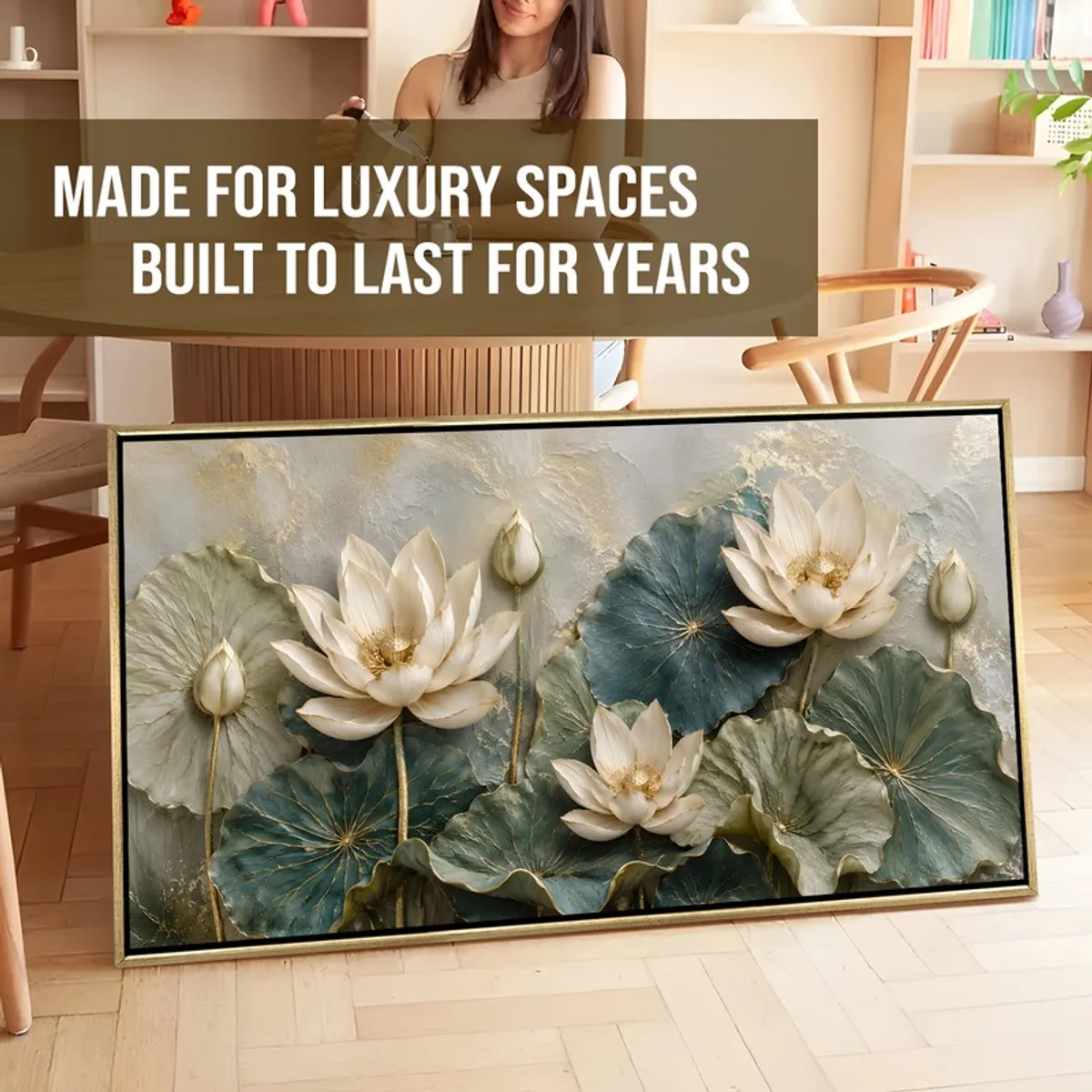 Large lotus canvas painting with gold frame leaning against the floor in an interior setting