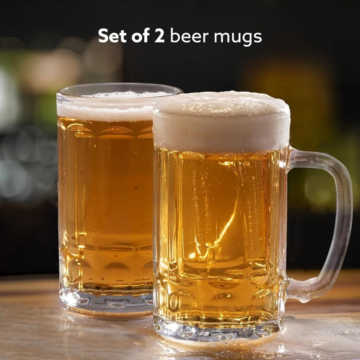 Two clear beer mugs filled with beer, shown as a set of two