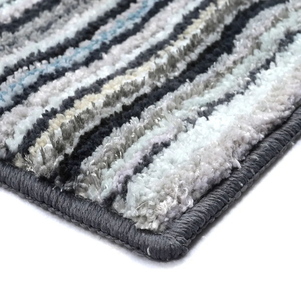 Close-up of the carpet's soft textured pile and finished corner