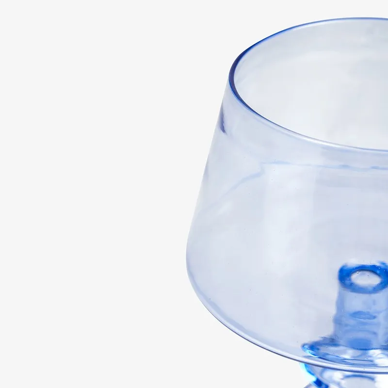 Close-up of the upper bowl of the blue glass candle holder
