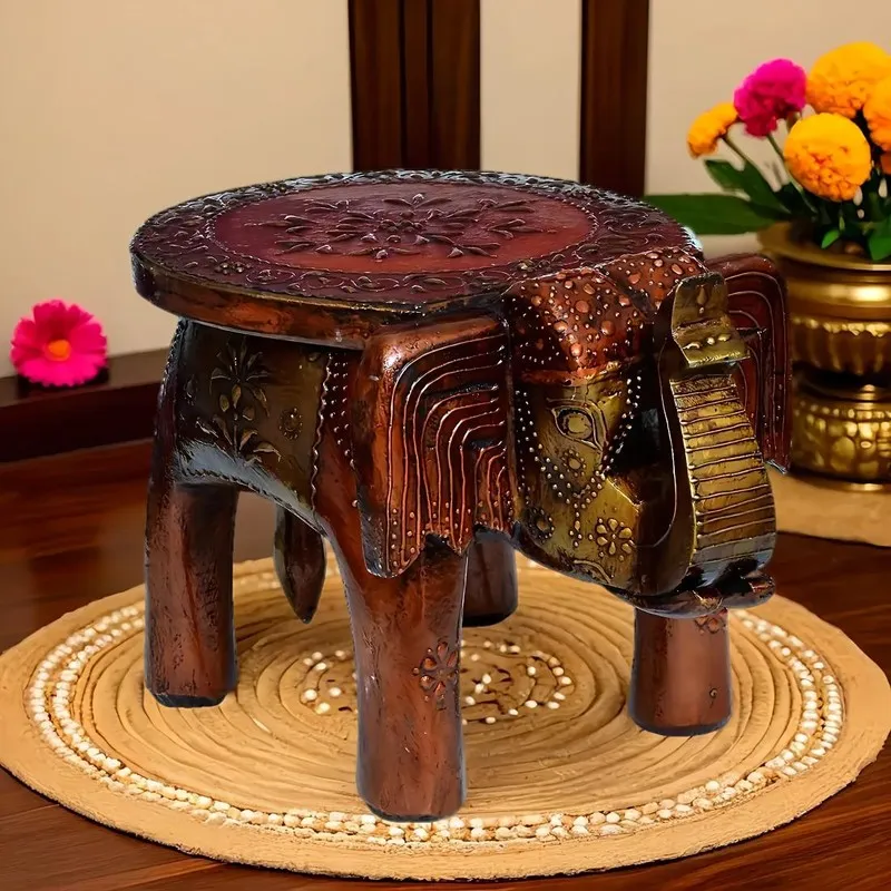 Brown wooden carved stool with detailed elephant-shaped base