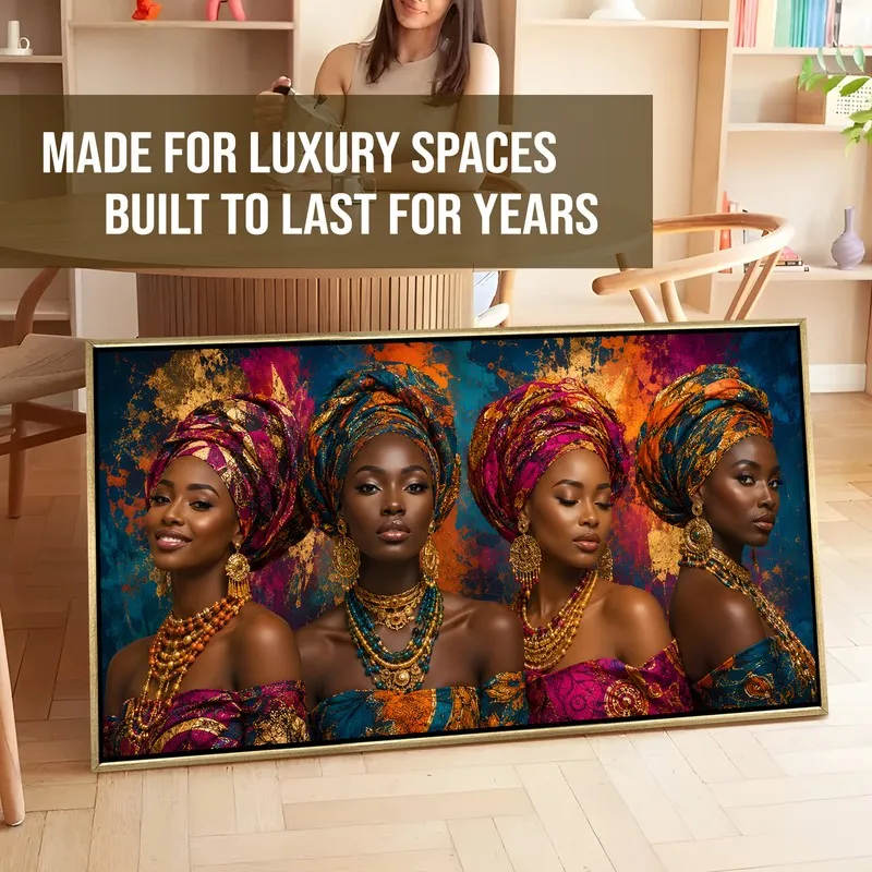 Framed multicolour portrait wall art leaning on a floor in a styled interior setting.