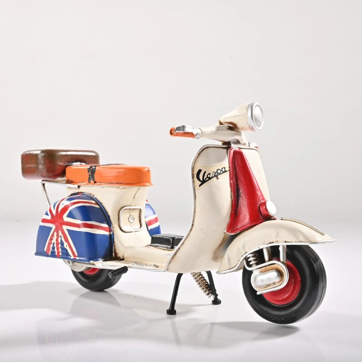 Multicolour scooter showpiece on a plain background