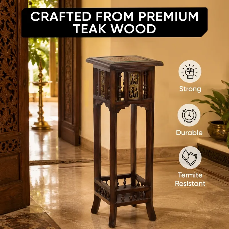 Teak wood side table in dark brown with square top and decorative side panels.