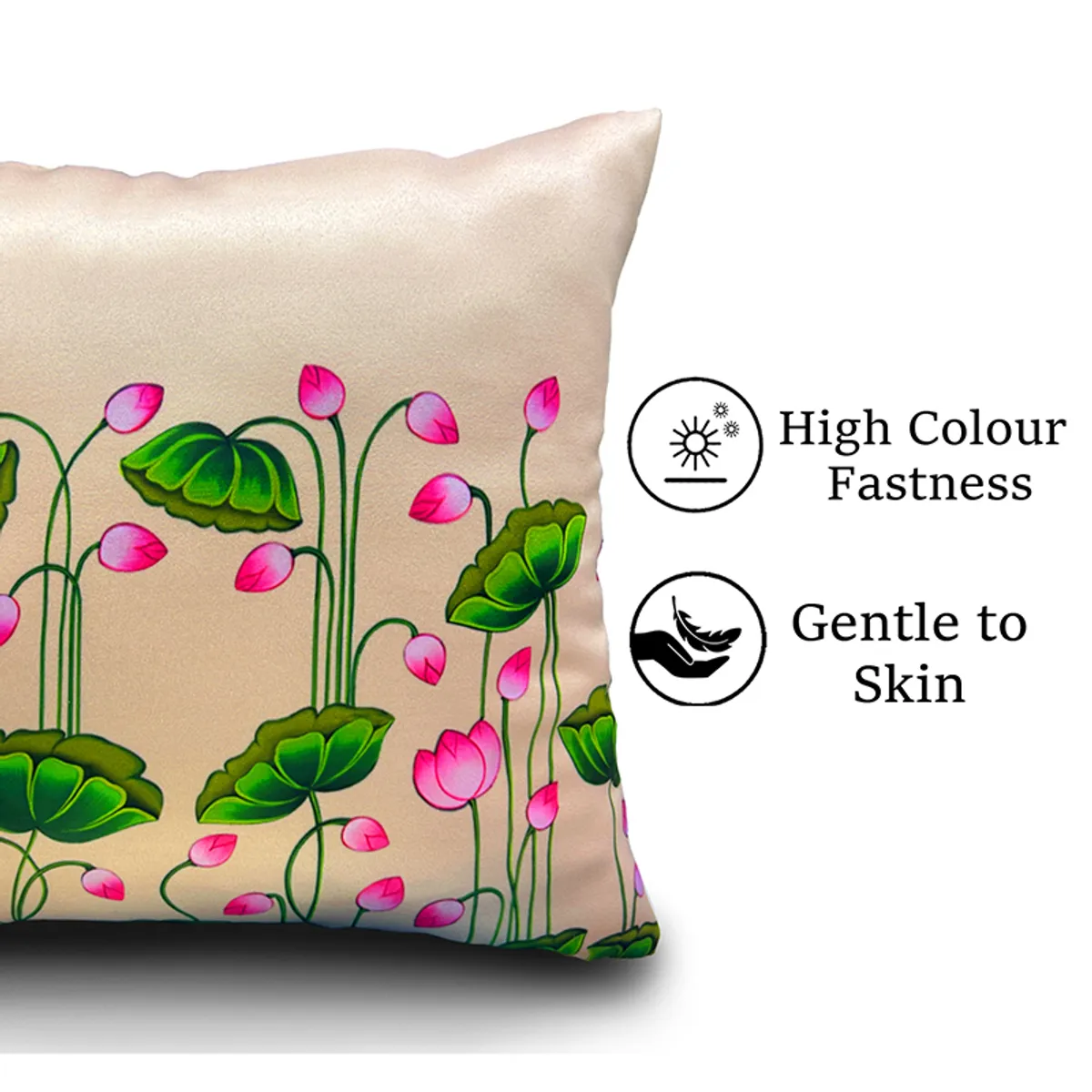 Close-up of a beige cushion cover with pink lotus blooms and green leaves