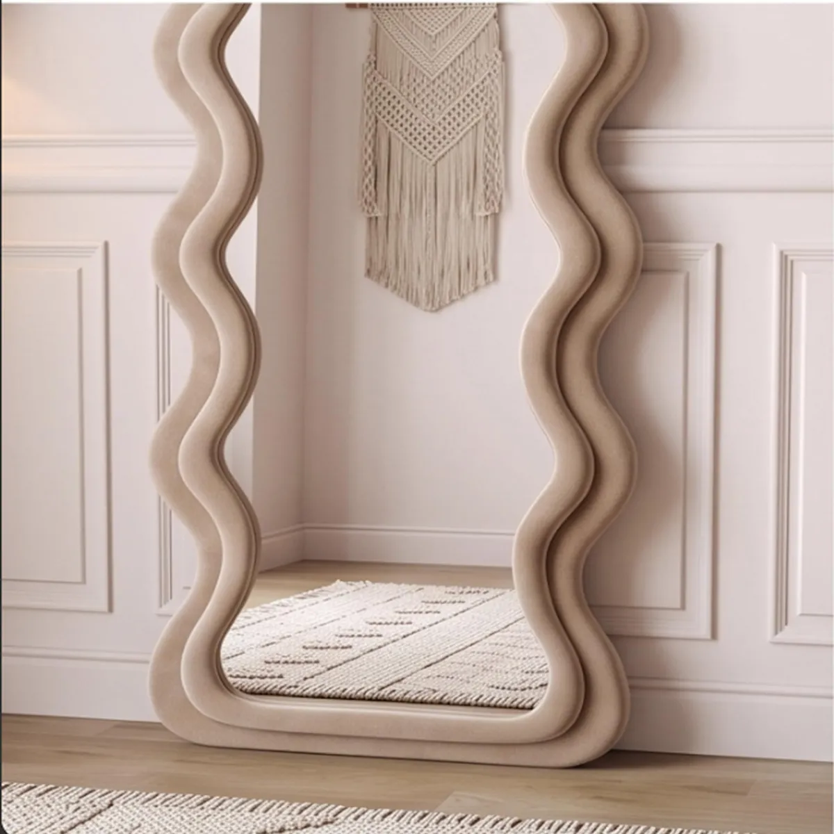 Lower section of a brown ripple mirror reflecting a neutral rug