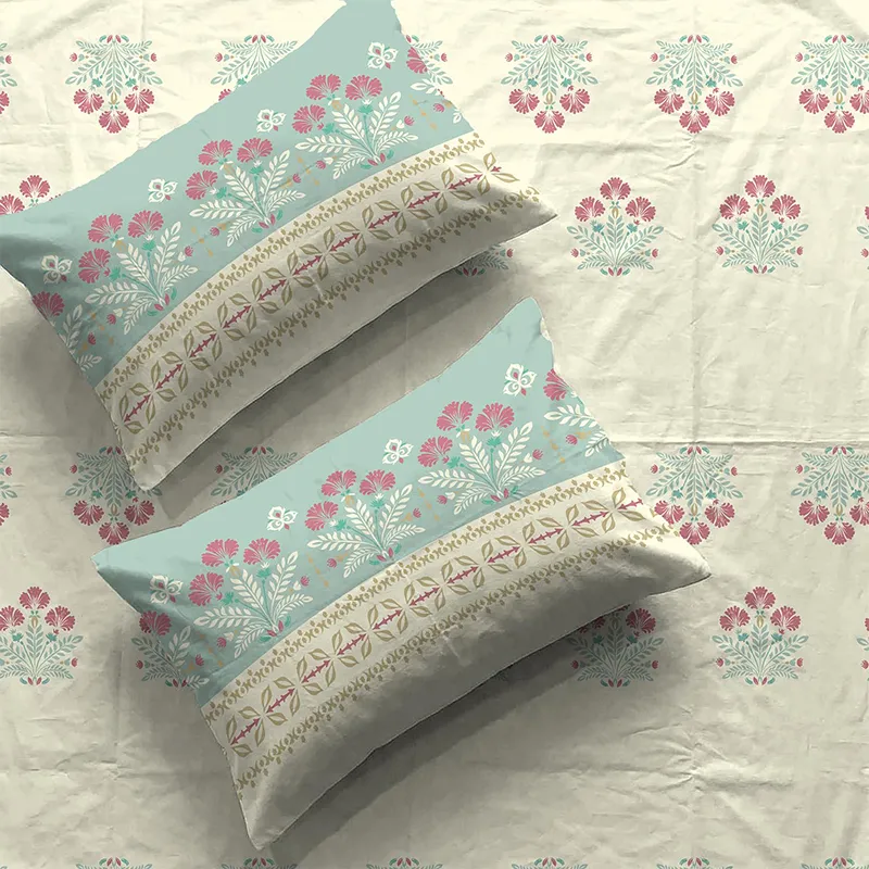 Close-up of off-white floral bedsheet with two matching printed pillow covers