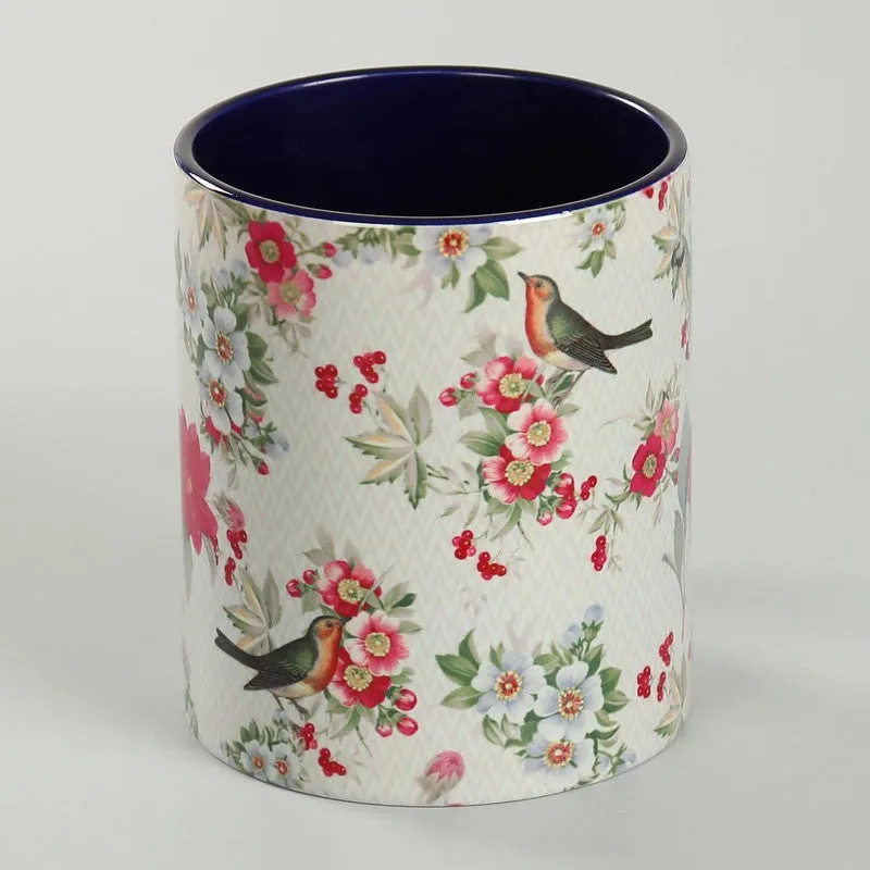 Side view of the ceramic mug with birds, flowers and berry motifs
