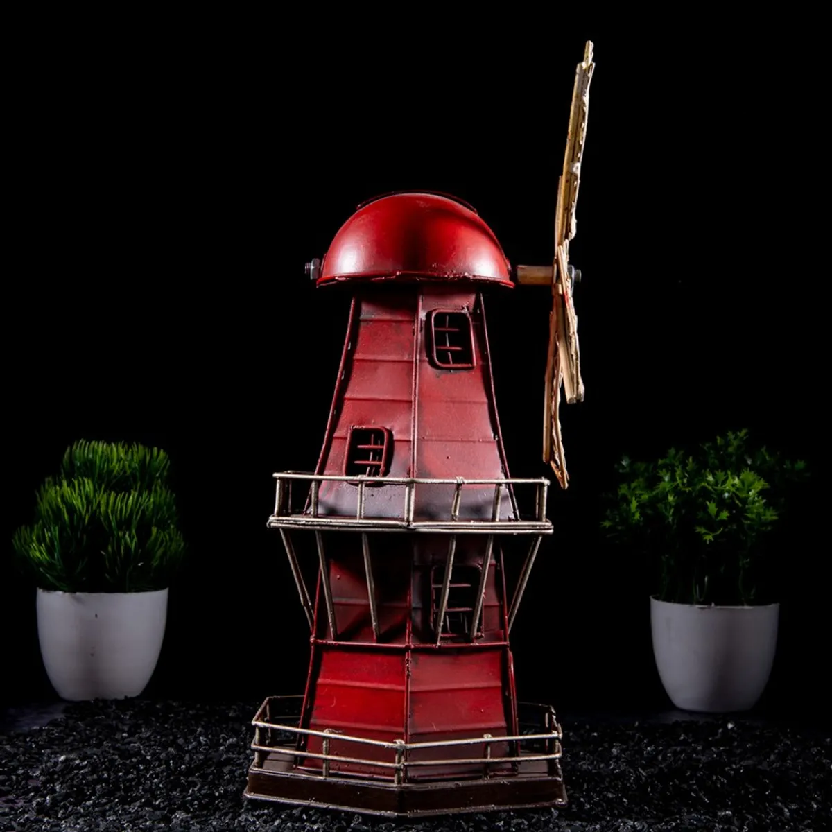 Side view of the red windmill metal showpiece
