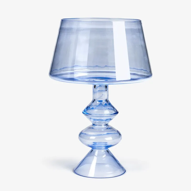 Blue goblet-style glass candle holder with a wide shade-like top