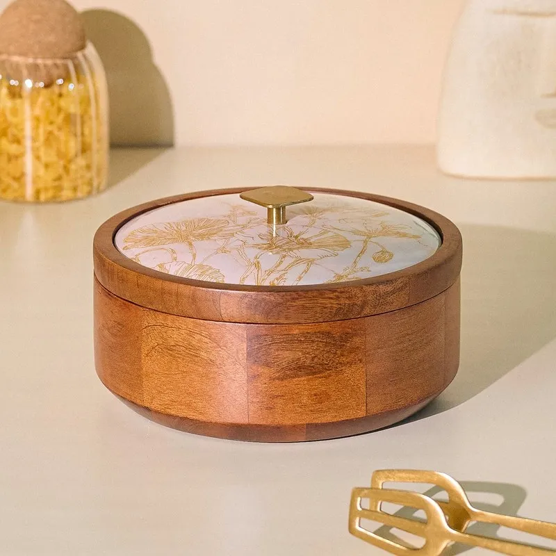 Closed round brown wooden masala box with glossy floral lid