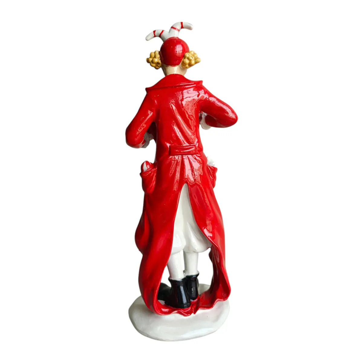 Rear view of the red-costumed clown figurine on its base
