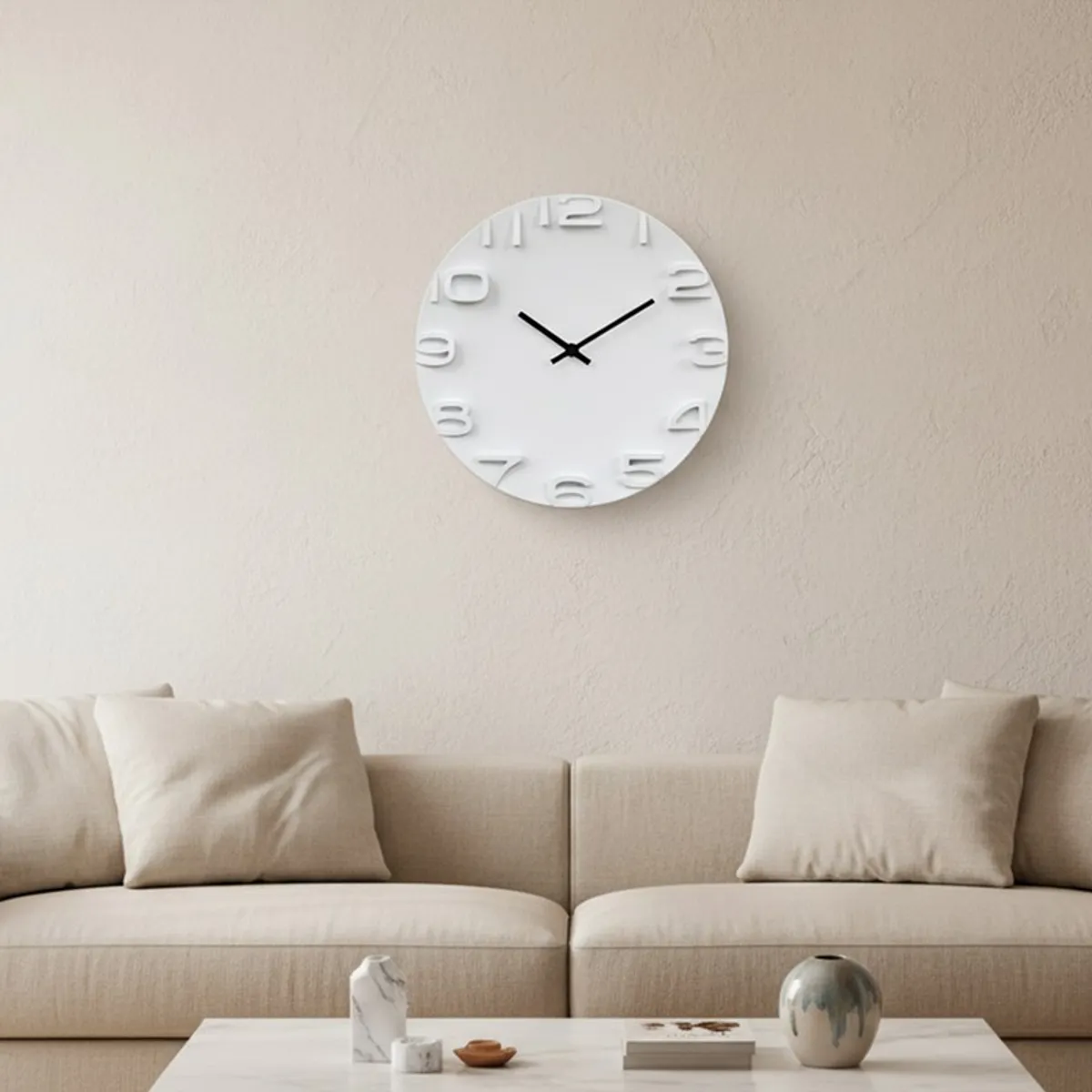White wall clock displayed above a neutral sofa in a contemporary living room