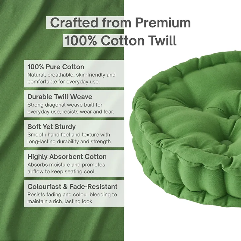 Close-up of a light green round floor cushion with a textured cotton surface