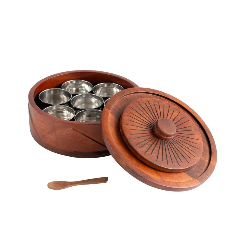 Brown wooden masala box opened to reveal seven empty steel compartments