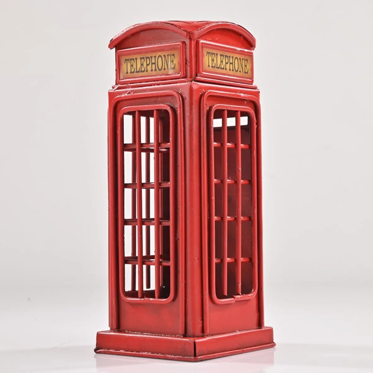 Front angled studio view of red telephone booth showpiece