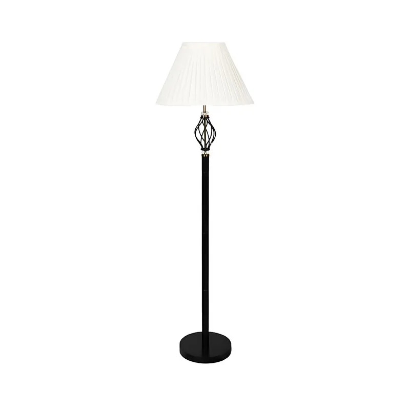 Full view of black floor lamp with white pleated shade on a white background