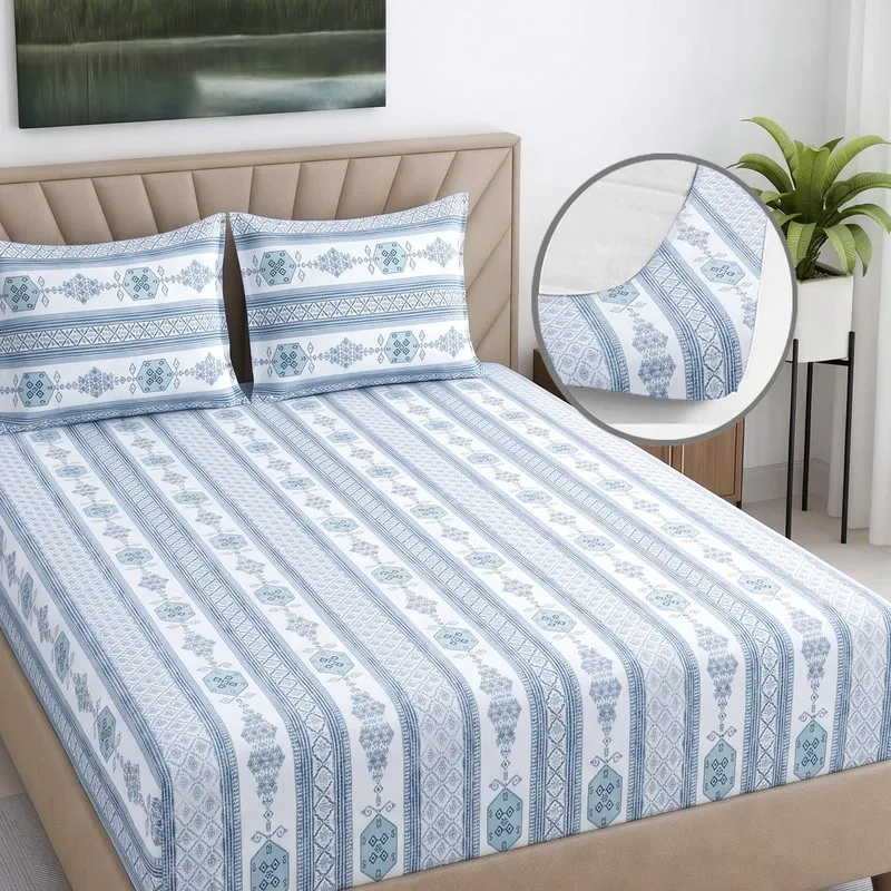 Blue and white fitted bedsheet with all-around elastic corner detail