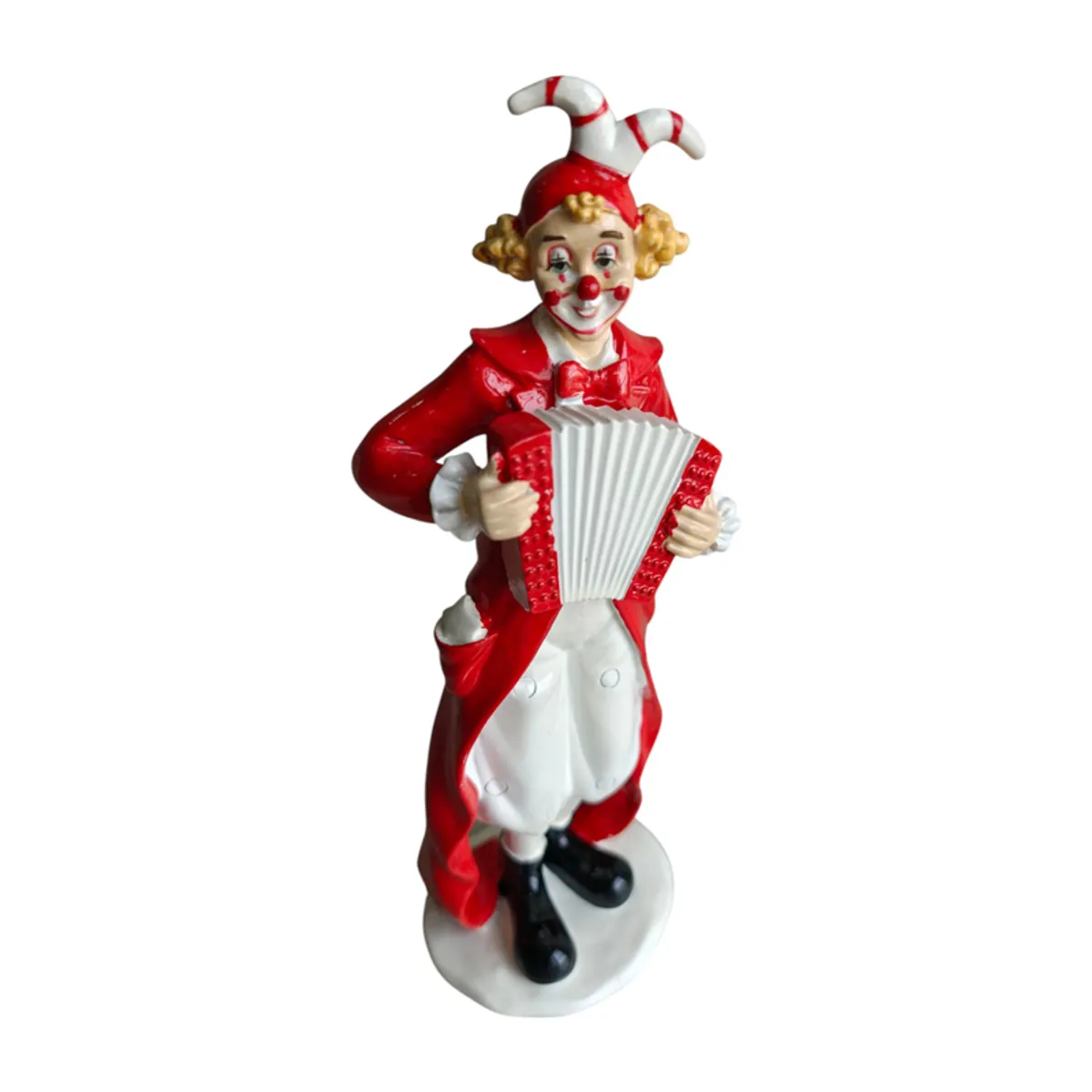 Angled view showing the clown figurine's accordion and decorative costume