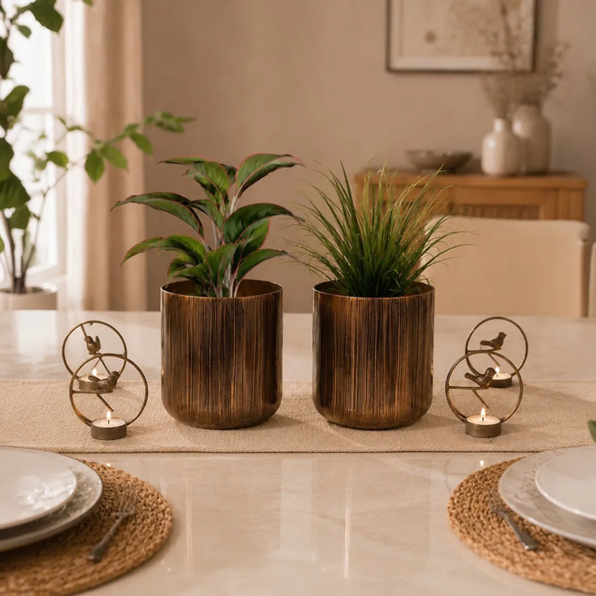 Two brown planters and four bird tealight holders arranged on a table