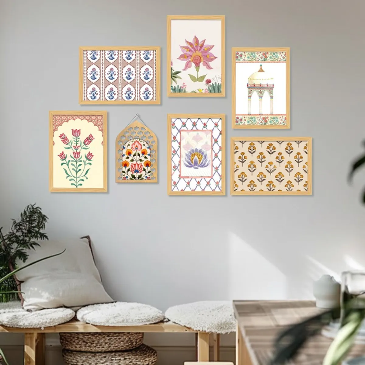 Seven colourful framed floral and geometric artworks on a neutral wall