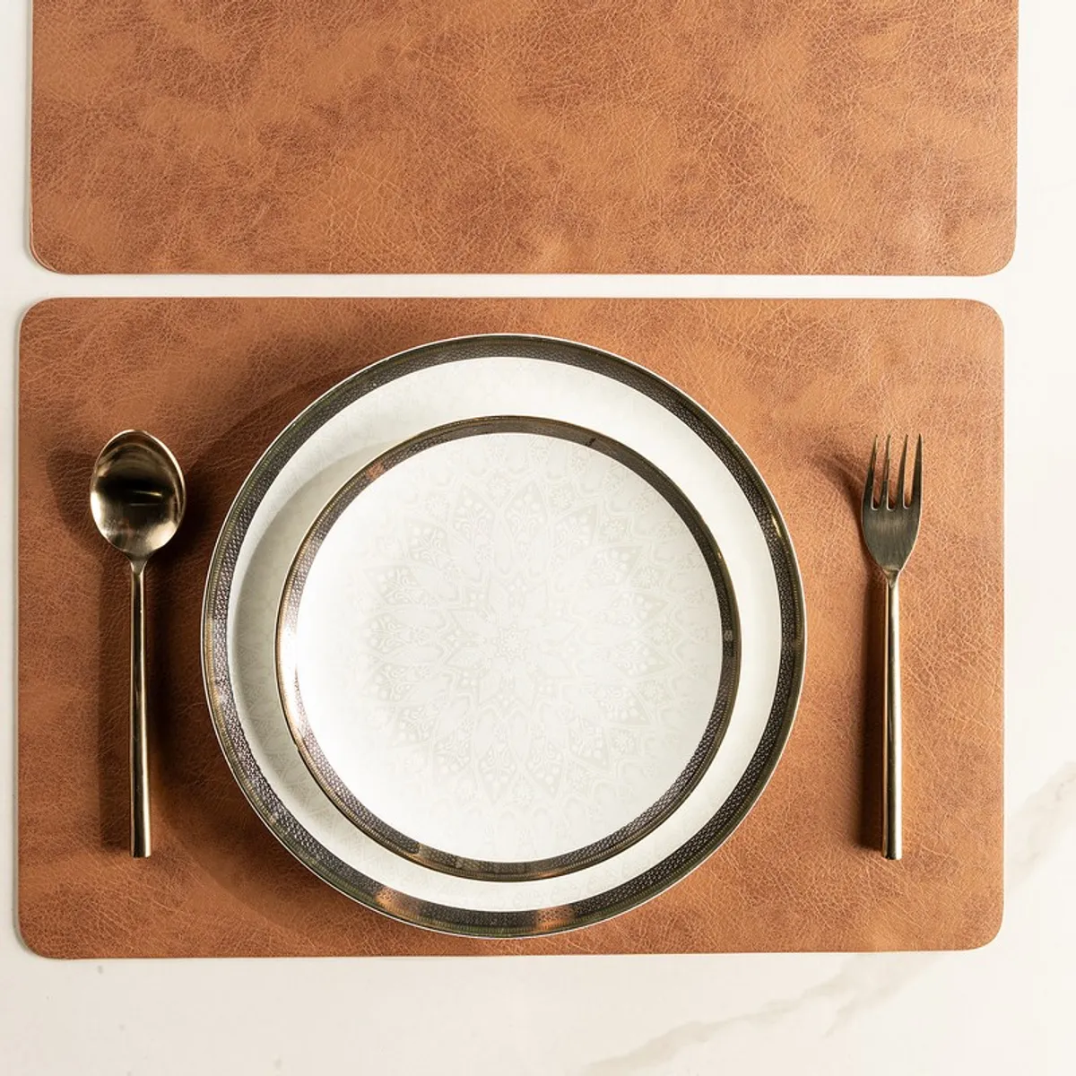 Brown textured rectangular table mat with plate and cutlery on top