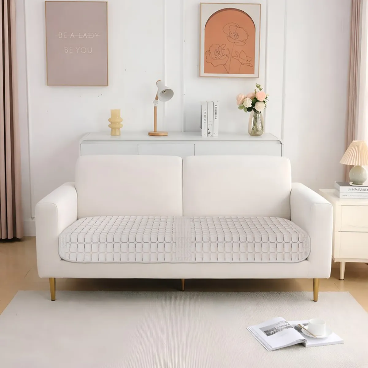 Beige geometric velvet cover displayed on a two-seater sofa