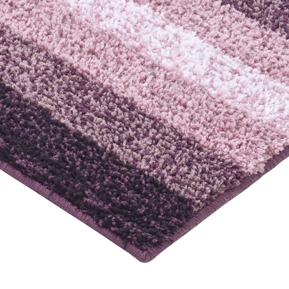 Close-up of the plush purple and pink textured bath mat surface