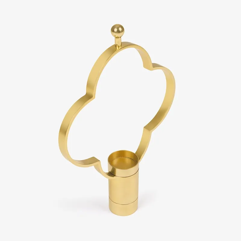 Side angle of the gold clover-shaped candle holder