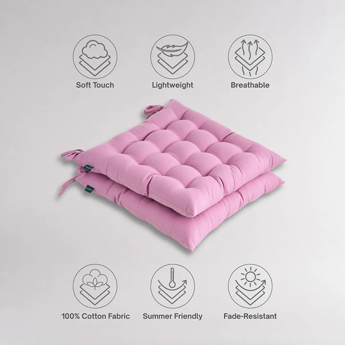 Stack of two lilac purple tufted chair pads with tie-ups