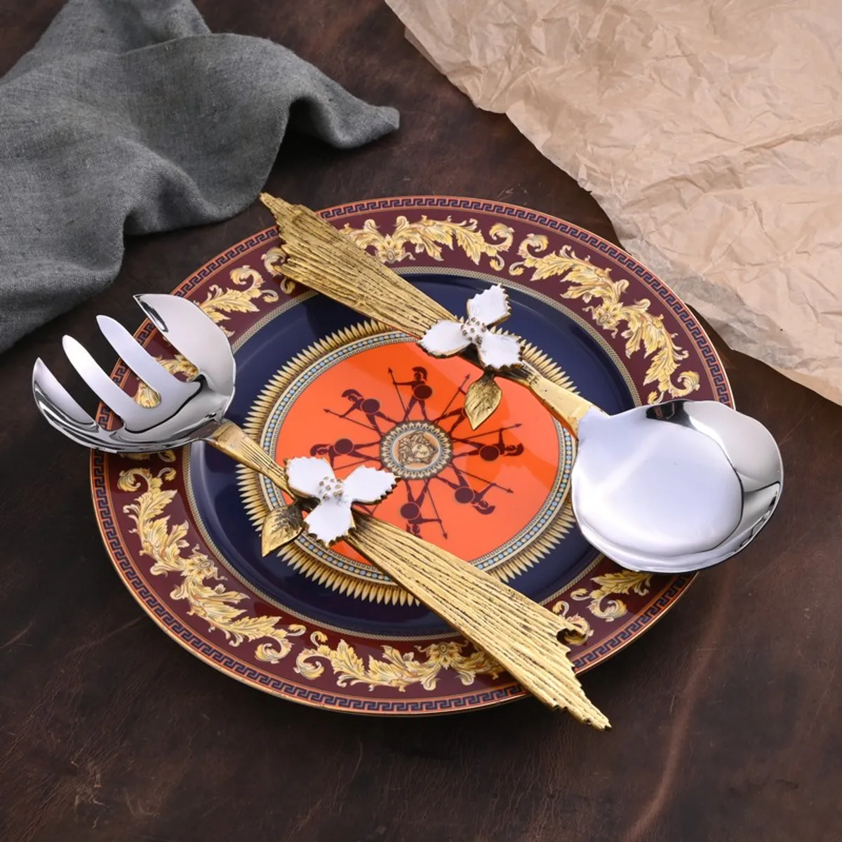 Fleur Branch salad spoon and fork displayed over an ornate dining plate