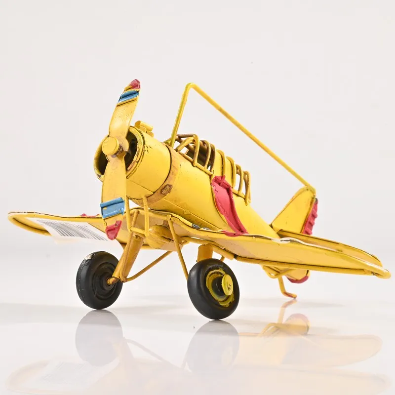 Yellow airplane showpiece photographed on a white background