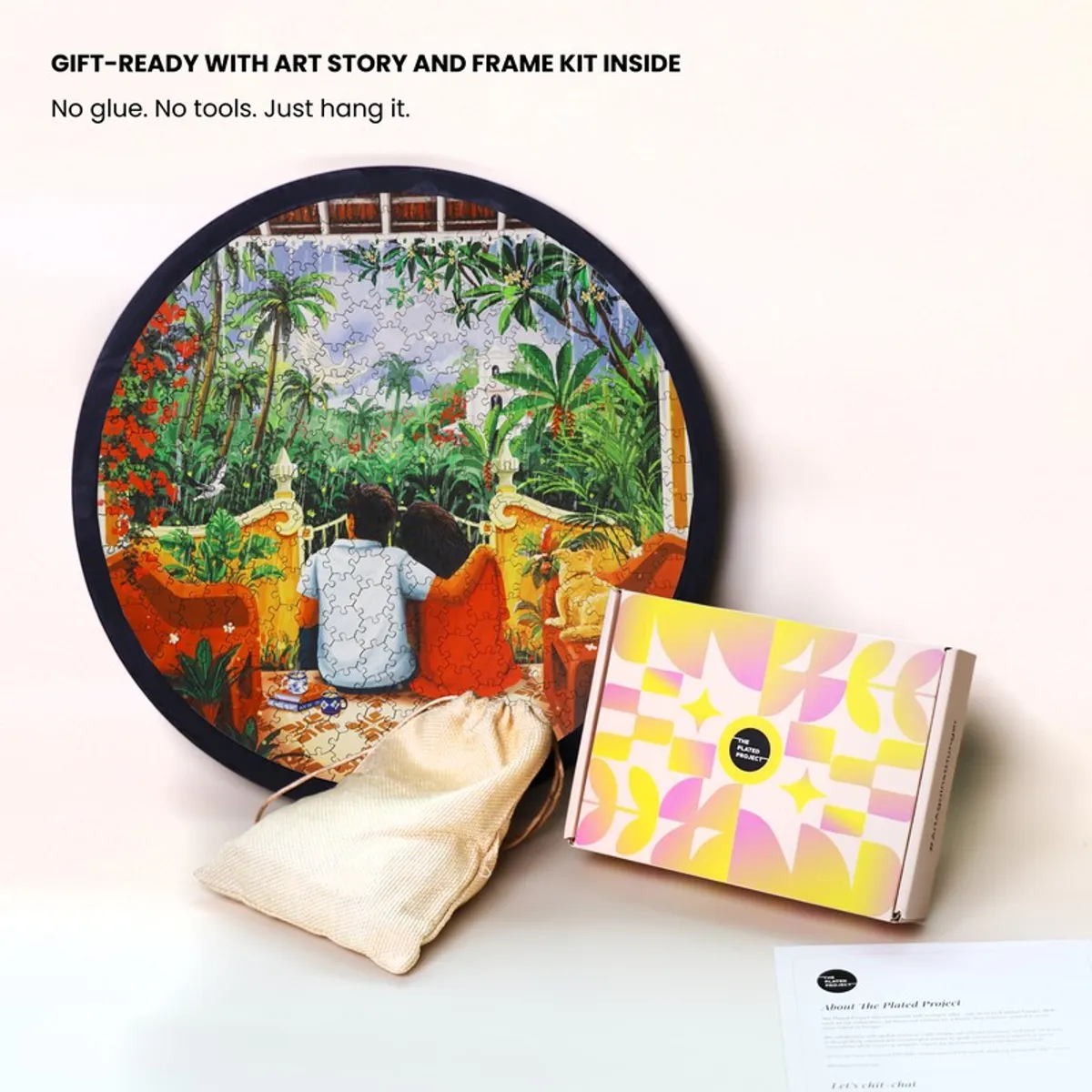 Round puzzle wall art shown with a pouch, box and printed insert