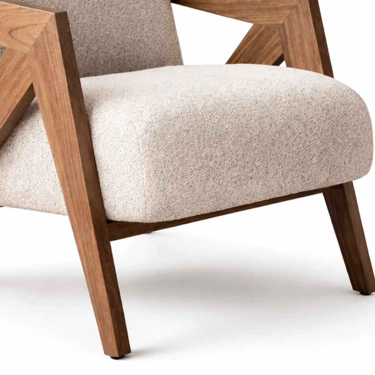 Close-up of textured white upholstery and teak wood chair frame