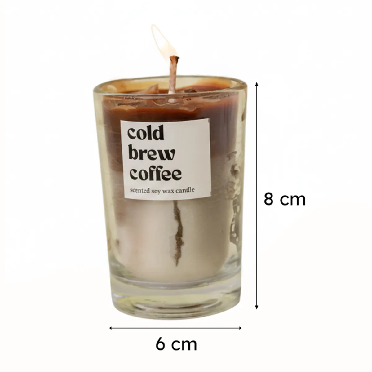 Close-up of a brown coffee candle in a clear glass container