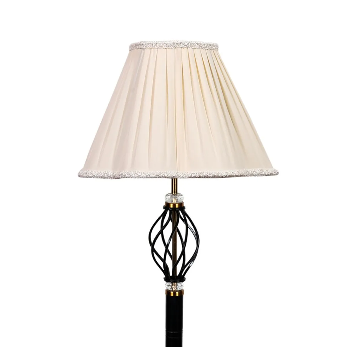 Close-up of pleated ivory shade and decorative black lamp stem
