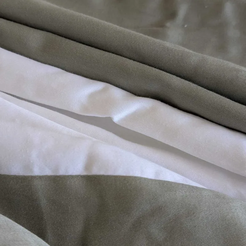 Close-up of green and white fabric layers and edge finish