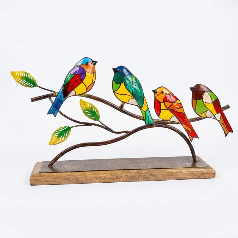 Front view of multicolour bird metal tabletop showpiece on a wooden base