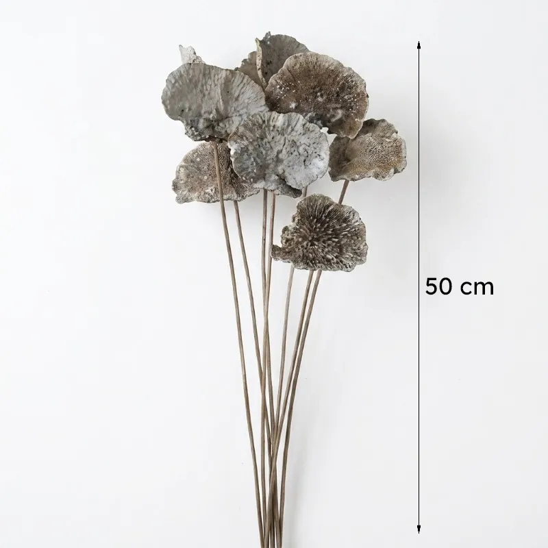 Bundle of beige artificial flowers shown against a white background