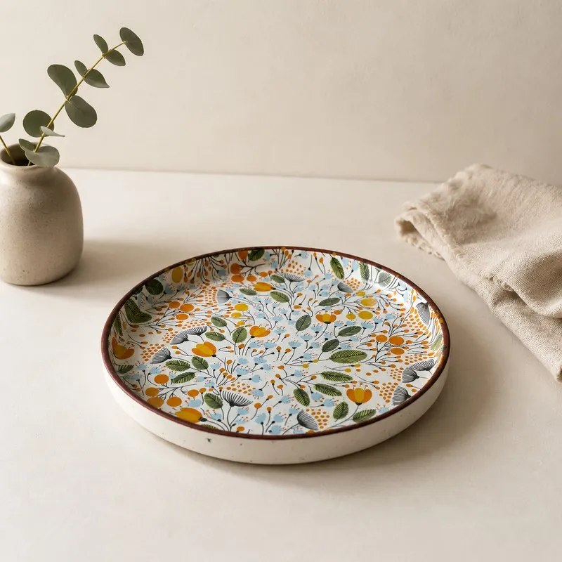 Single round ceramic dinner plate with multicolour botanical pattern