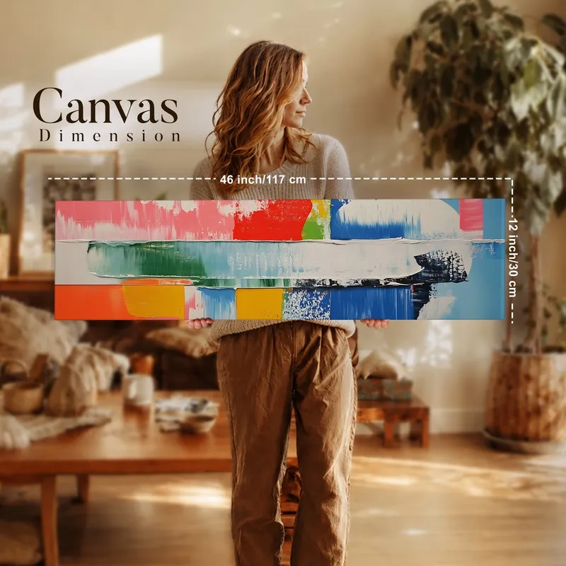 Person holding rectangular multicolour abstract canvas wall art