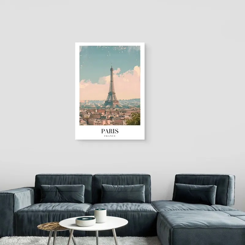 Paris Eiffel Tower canvas print above a blue sectional sofa and round coffee table