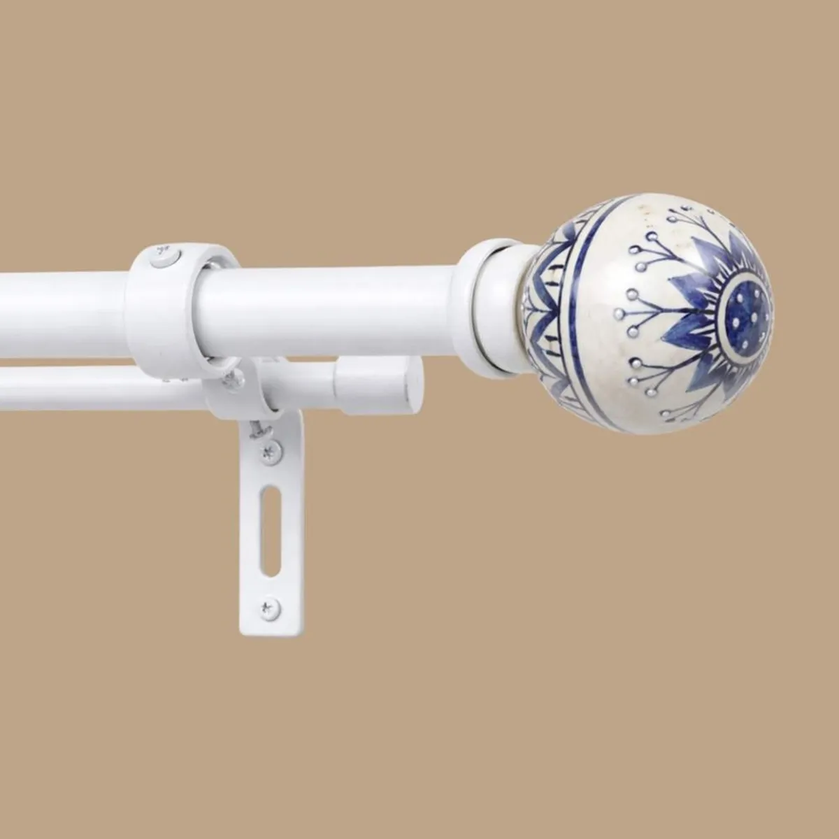 Close-up of the white double rod and blue-and-white patterned round finial
