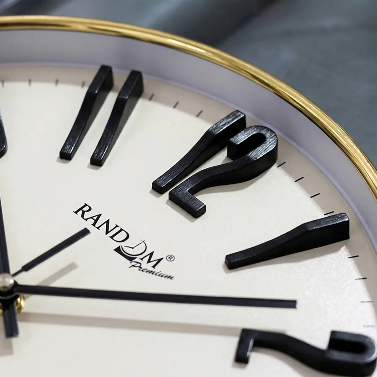 Detailed view of the clock face and raised black numeral design