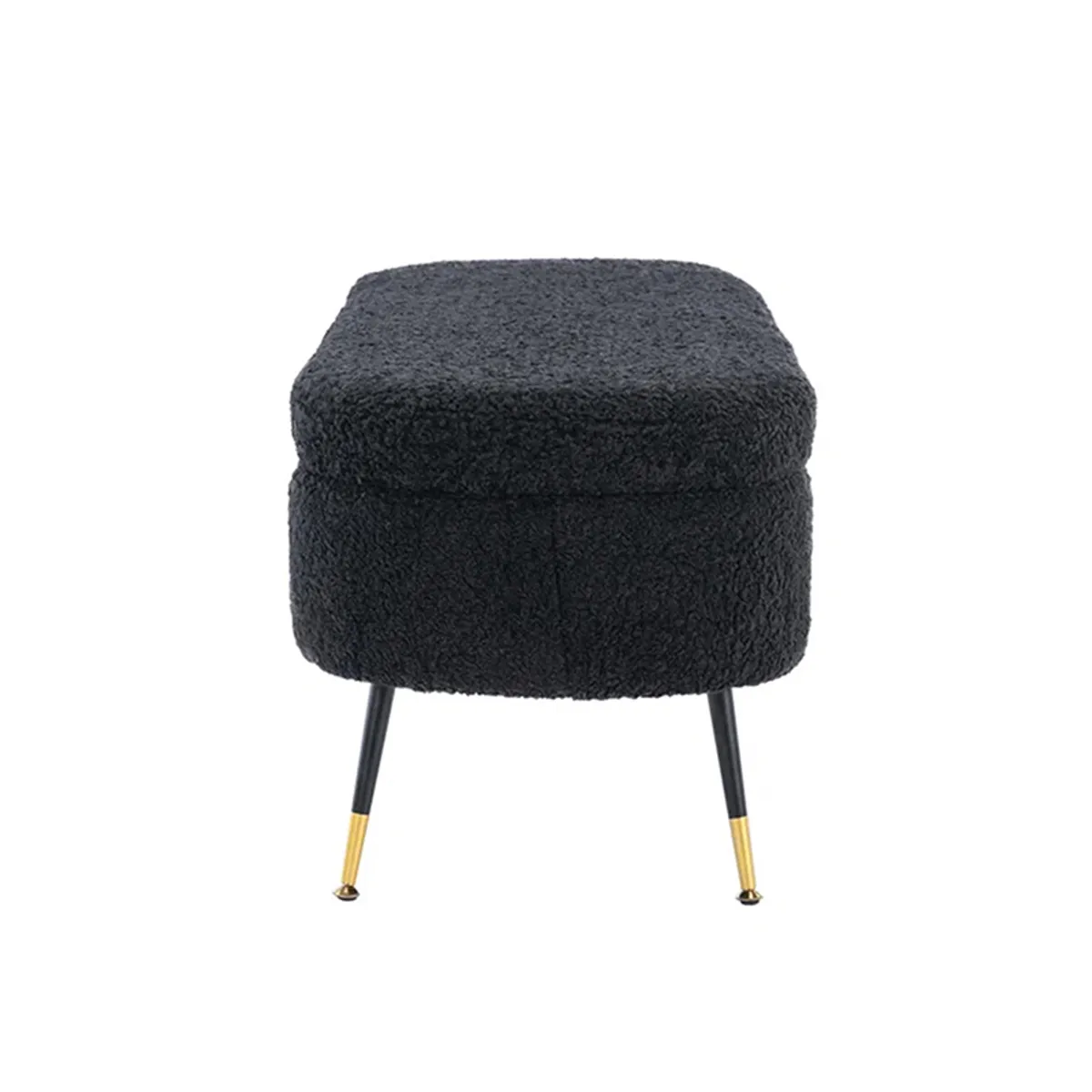 Side view of a dark grey upholstered bench with two tapered legs